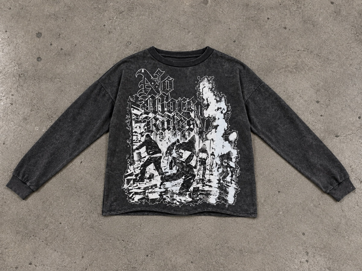 NMR Riot T washed black long-sleeve graphic tee photographed flat on concrete